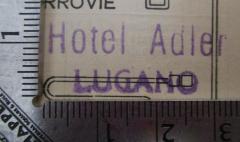 - (Hotel Adler (Lugano)), Stempel: Name, Berufsangabe/Titel/Branche, Ortsangabe; 'Hotel Adler Lugano'.  (Prototyp)