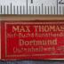 J / 1227 (Max Thomas Buch- und Kunsthandlung (Dortmund)), Etikett: Buchhändler, Name, Ortsangabe; 'Max Thomas
Hof- Buch & Kunsthandlung
Dortmund
Ostenhellweg 49.'.  (Prototyp)