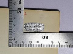 - (Buchhandlung Putty Schneider vorm. Bück), Etikett: Buchhändler; 'Buchhandlung Putty Schneider vorm. Bück Luxemburg'. 