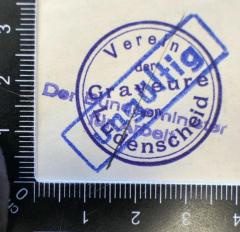 - (Verein der Graveure (Lüdenscheid)), Stempel: Name, Berufsangabe/Titel/Branche, Ortsangabe; 'Verein
der 
Graveure
von
Lüdenscheid'. 